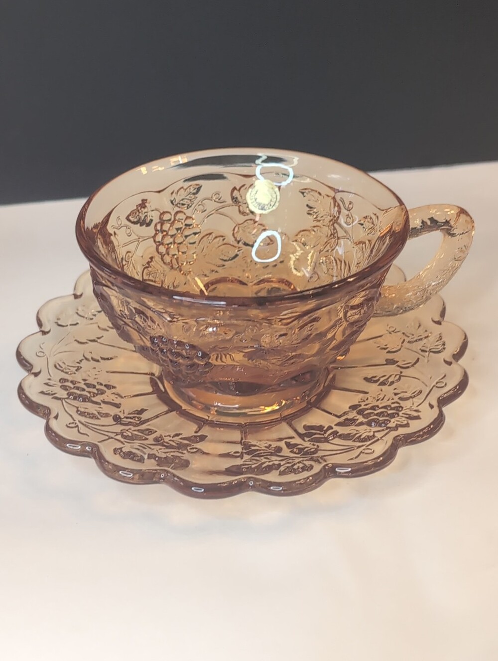 Vintage Westmoreland Amber Glass Teacup And Saucer Grape Leaf Embossed